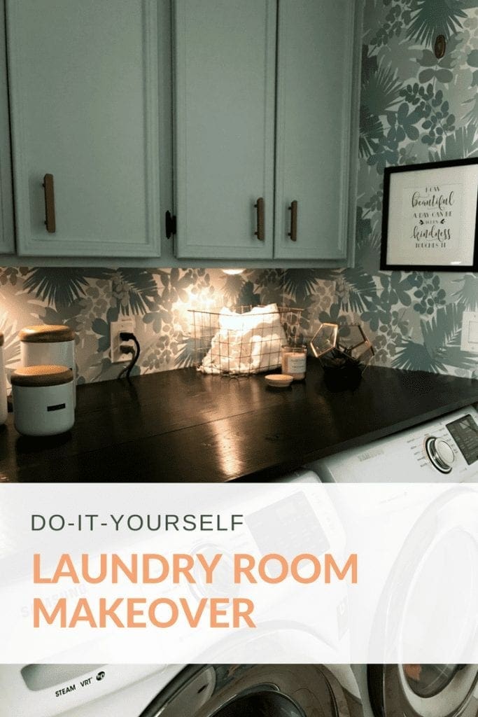 DIY laundry room makeover with ideas on functional organization for a small space. Painted cabinets, new lighting, clothesline, countertop wood shelf above our front loading machines. A dream design with removable wall paper from Target and decor from Home Goods.
