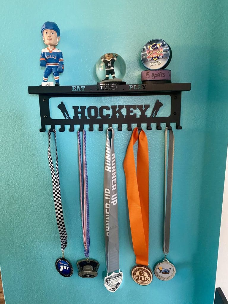 Hockey medal shelf for a tomboy bedroom.